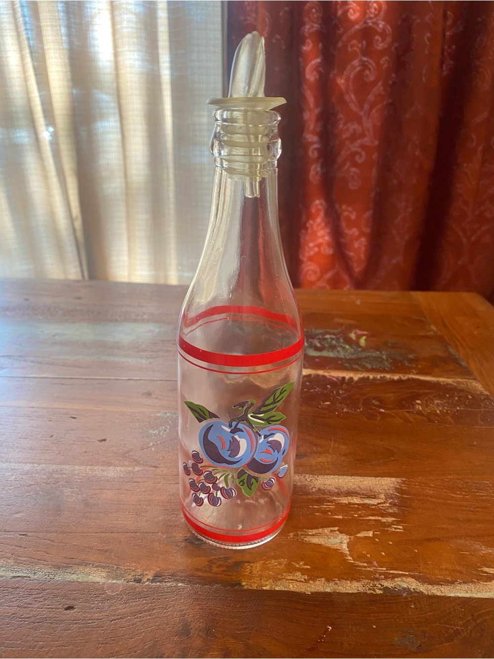 Clear Glass Oil Bottle with Red Trim and Blue Fruit Design